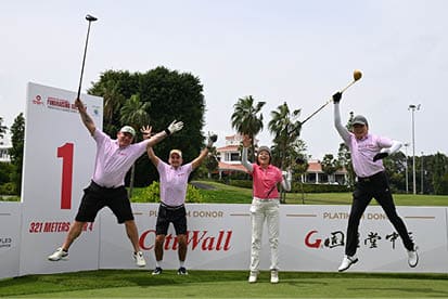 Four people are standing on a golf course, holding golf clubs and posing for a picture. AI generated content