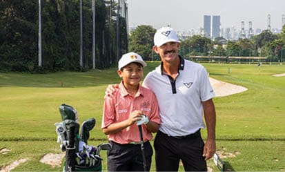 A man and a boy are standing on a golf course, holding golf clubs. AI generated content