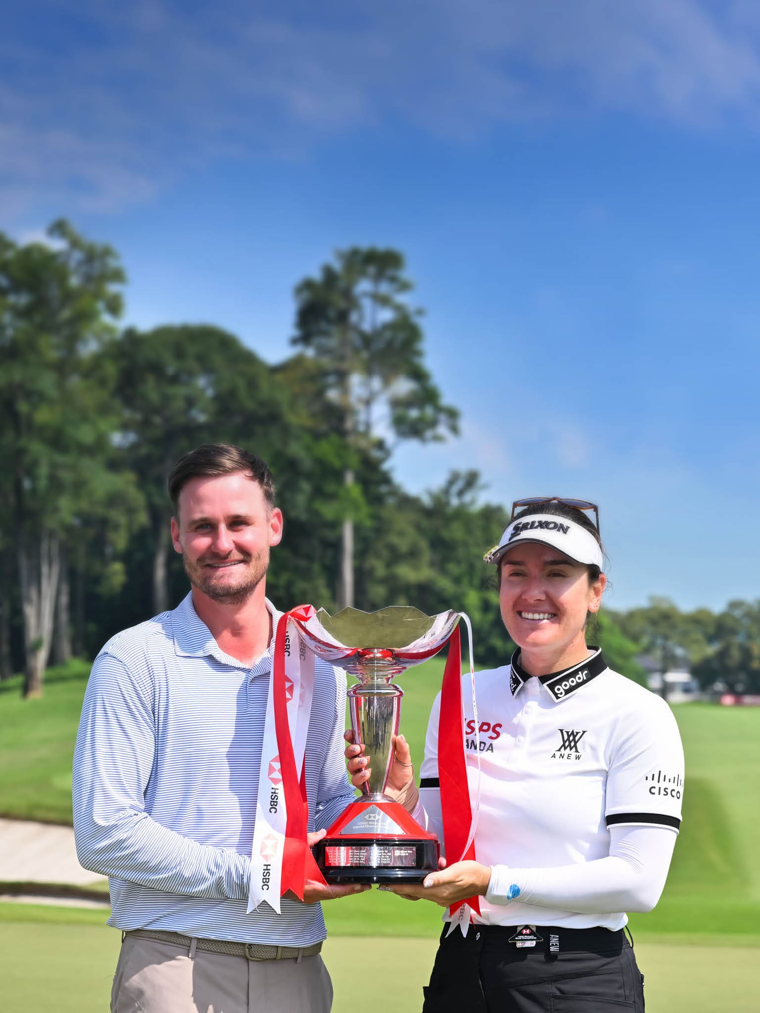 A man and a woman are standing on a golf course, holding a trophy. AI generated content